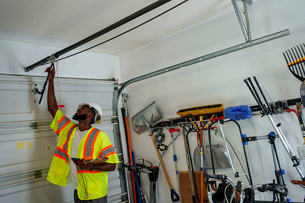 Professional Garage Door Installation technician working in East Pittsburgh, PA
